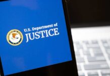 DOJ Backs Off $722M Crypto Bombshell – WHY?! U.S. Department of Justice logo on a smartphone screen