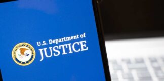 U.S. Department of Justice logo on a smartphone screen