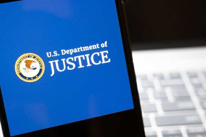 Warsaw,,Poland,-,Feb,26,,2026:,Image,Of,The,U.s. U.S. Department of Justice logo on a smartphone screen