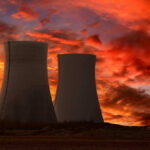 Heat Wave Hands DOE The Switch Nuclear power plant cooling towers at sunset.