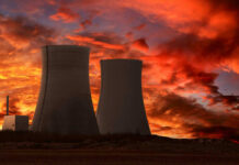 Heat Wave Hands DOE The Switch Nuclear power plant cooling towers at sunset.