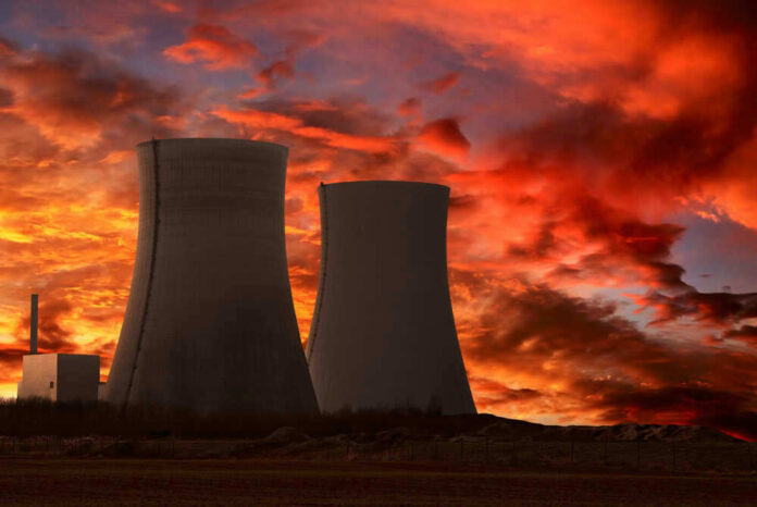 shutterstock_73078270 Nuclear power plant cooling towers at sunset.