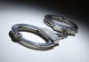 Marshal Killed — Suspect Captured Close-up of metallic handcuffs on a light surface