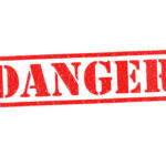 Flesh-Eating Threat Surges — Gulf on Edge Red danger stamp on white background