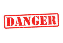 Flesh-Eating Threat Surges — Gulf on Edge Red danger stamp on white background