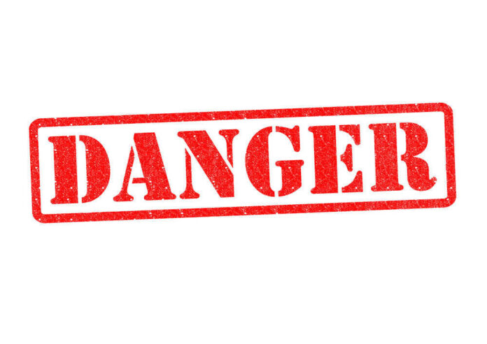 shutterstock_142860013 Red danger stamp on white background
