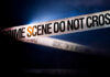 Teen Attacked With Sword, One Dead — Why? Police tape reading 'CRIME SCENE DO NOT CROSS' in a dark setting
