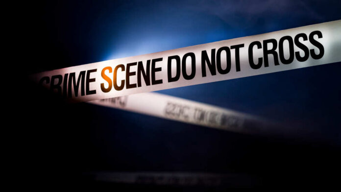 Tape,Encloses,Crime,Scene,,Refreshed,By,Spotlight Police tape reading 'CRIME SCENE DO NOT CROSS' in a dark setting