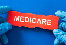 Medicare Shake-Up: Costco’s Quiet Power Play Gloved hands holding a torn red paper strip