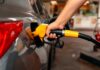Gas Pain Craters Confidence A person refueling a car at a gas station
