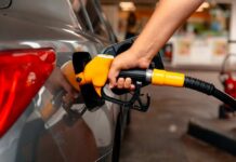 Gas Pain Craters Confidence A person refueling a car at a gas station