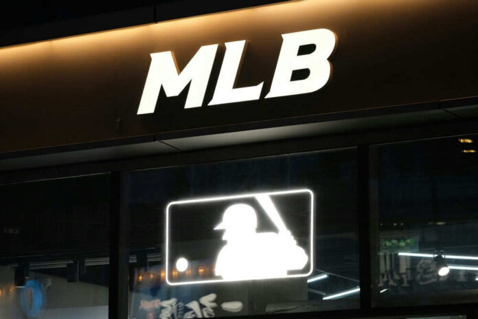 Illuminated MLB sign above storefront window