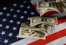 Strangers Sprint For Stashed Bills Dollar bills arranged on an American flag
