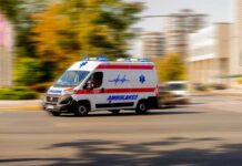 HORRIFYING VIDEO: Glacial Burst Wipes Out Thousands Ambulance van with flashing lights speeding through a city street