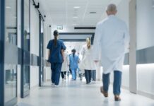 Hospital Trip Over A Donut Label? Medical staff walking through a hospital corridor