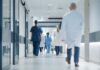 Medical staff walking through a hospital corridor