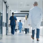Beloved Influencer, Brutal Diagnosis, Unthinkable End Medical staff walking through a hospital corridor