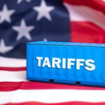 Tariff War Escalates: American Ally Strikes Back Shipping container reading tariffs on the American flag