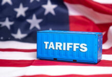 Tariff War Escalates: American Ally Strikes Back Shipping container reading tariffs on the American flag