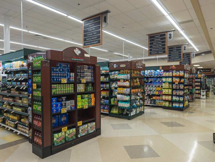 Cary,,North,Carolina,-,June,28,2025:,Shoppers,Browsing,Wide Interior view of a grocery store aisle with shelves of food and beverages