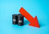 America’s Oil Cushion VANISHES — 1983 Levels! Three black oil barrels with the word 'OIL' and a red downward arrow