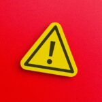 VIDEO: Deadly Landslide Buries Sleeping Families Yellow warning sign with exclamation mark on red background