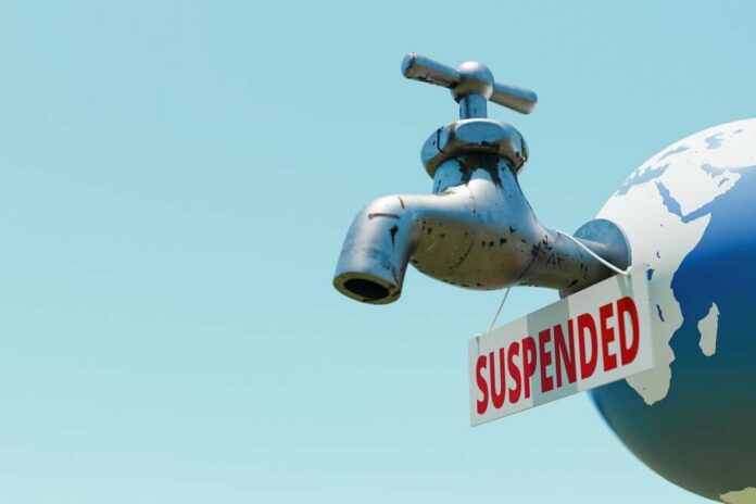 Suspended,Water,Supply,Sign,On,Earth,Globe,Faucet,Copy,Space.