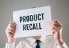 Amazon Yanks Mom Food Item Over Salmonella Scare Person holding a sign reading product recall