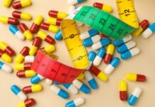 Weight-Loss Black Market Exposed Colorful capsules scattered with a measuring tape