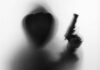 Armed Stalker Caught At Trump Course? Silhouetted hooded figure holding a handgun