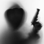 Armed Stalker Caught At Trump Course? Silhouetted hooded figure holding a handgun