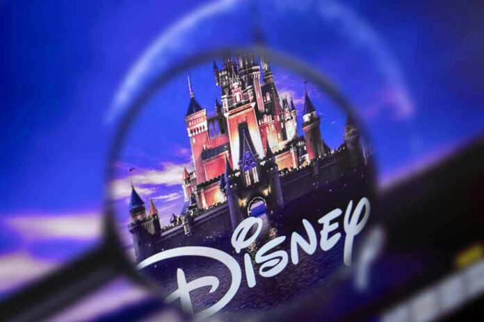 1341385184 Magnifying glass focusing on Disney castle logo.