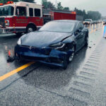 Highway Work Zone Turns Into Death Trap Car crash with a Tesla on a rainy highway.
