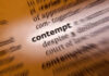 Dictionary Shake-Up: 1,400 Words Added Blurred dictionary entry focusing on the word 'contempt'