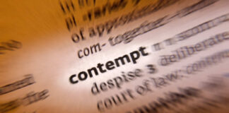 Blurred dictionary entry focusing on the word 'contempt'