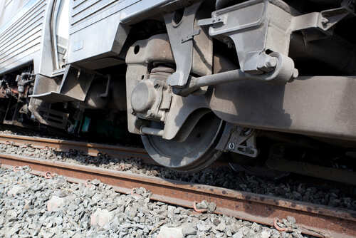 Train,Derailment Close-up view of a train wheel on railway tracks