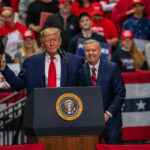 TRUMP Endorsement Topples 24-Year Senator Donald Trump and Lindsey Graham at a rally podium; Christian Jones not visibly identifiable