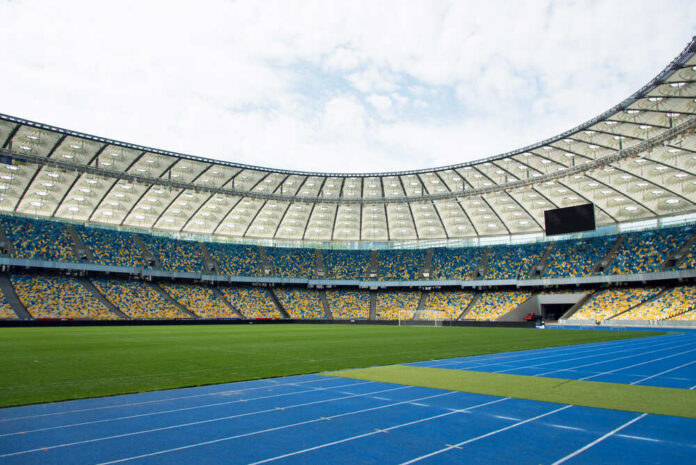 Kiev,,Ukraine,-,May,17,,2019,-,Panoramic,View,Of Empty stadium with blue running track and green field