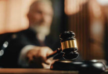 Brutal Murder Case Ends In Maximum Punishment Judge striking gavel in courtroom.