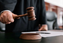 Judge Judy’s Final Ruling Announced Judge holding gavel in courtroom.