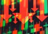 VIDEO: Decade-Low Jolt – Worst Since 2014 Red downward arrows over red and green stock candlestick chart