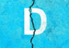 Stunning Rout Topples Democrat Governor White letter D on cracked blue surface.