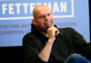 John Fetterman holding microphone.