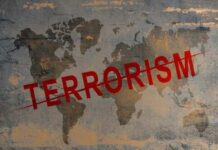 World map with the word TERRORISM crossed out in red