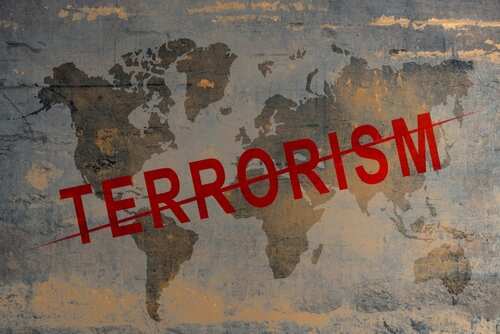 Bricked,Wall,With,Stop,Terrorism,Sign World map with the word TERRORISM crossed out in red