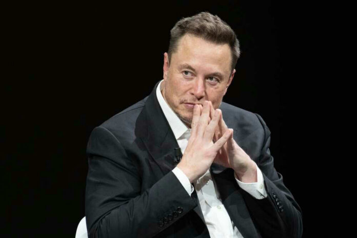 shutterstock_23188002871 Elon Musk in suit thinking.