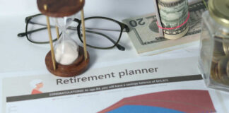 Retirement planner graph with money glasses hourglass