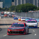 Racing Icon’s Chilling Diagnosis Saddens Fans Stock car race on urban street circuit.