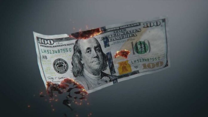 3d,Graphics,Of,Burning,One,Hundred,Dollar,Bill.,Visualization,Of Silhouetted operator with headset using laptop before American flag