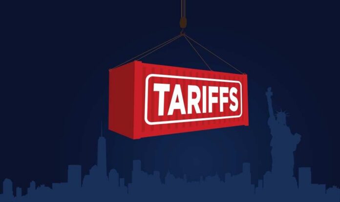 shutterstock_2607253429 Red shipping container labeled 'TARIFFS' suspended above a city skyline